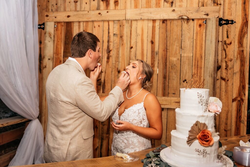 cake cutting at rustic oaks ranch wedding 