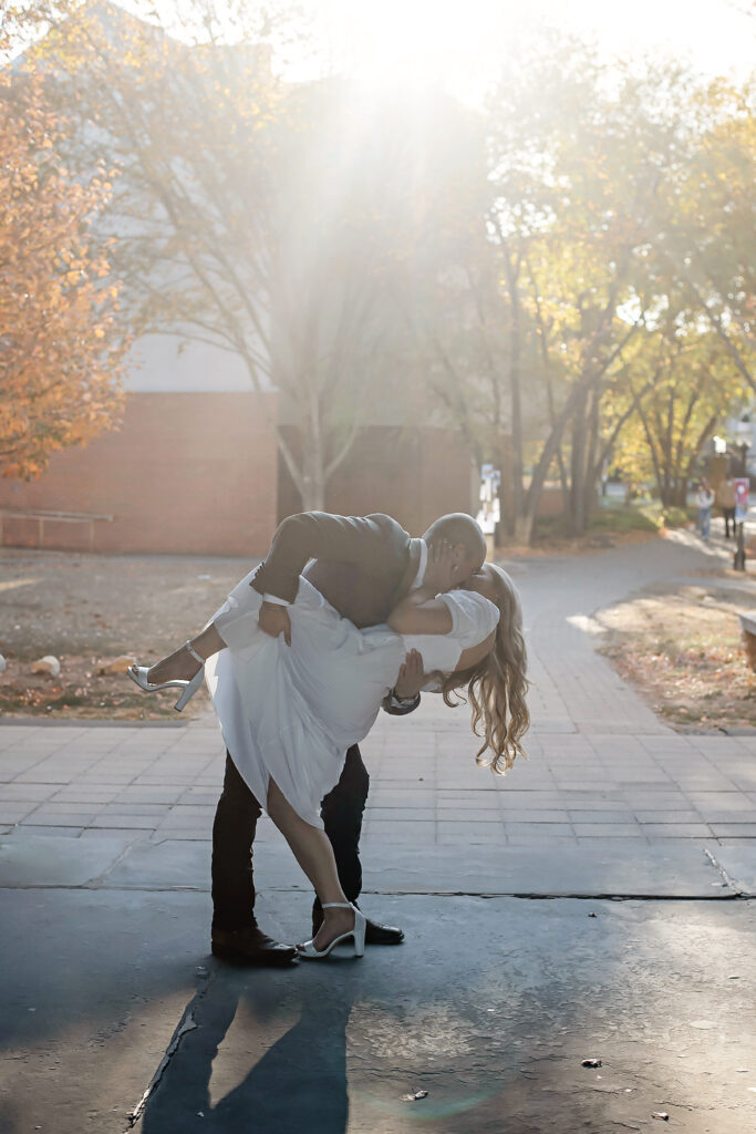 man dipping woman for a kiss