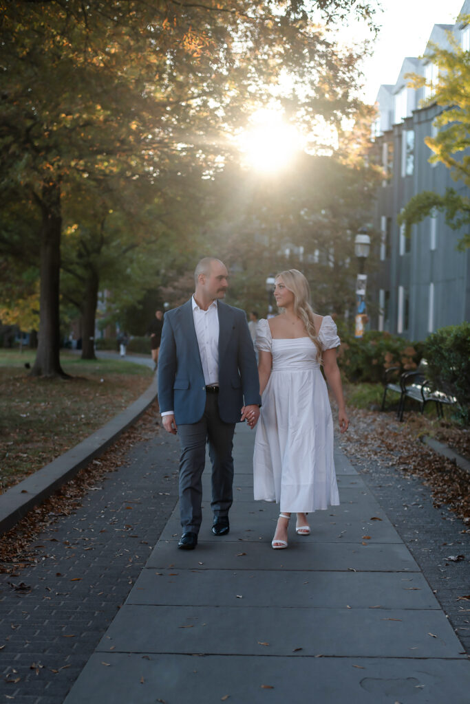 couple holding hands and walking