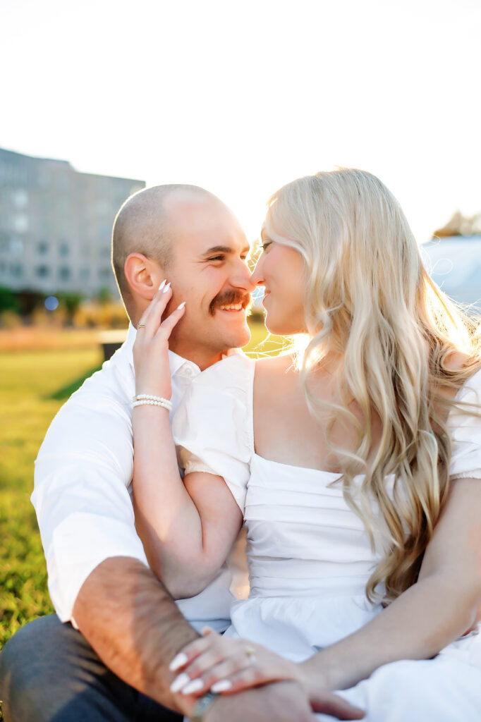 couple smiling at each other sitting down