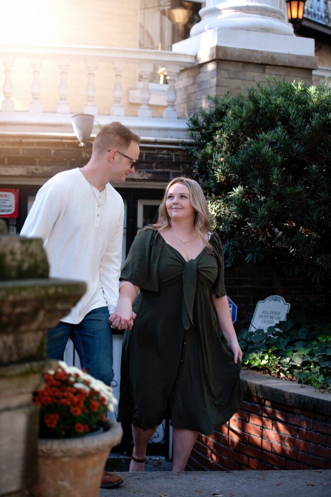 couple walking up the stairs at their savannah georgia engagement photos