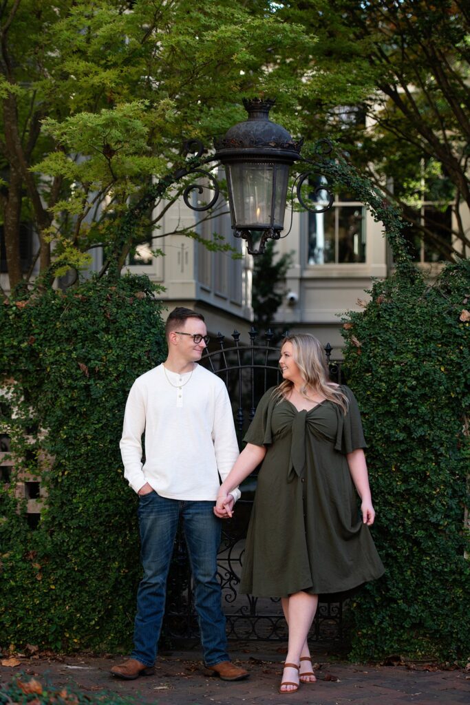 couple holding hands and looking at each other