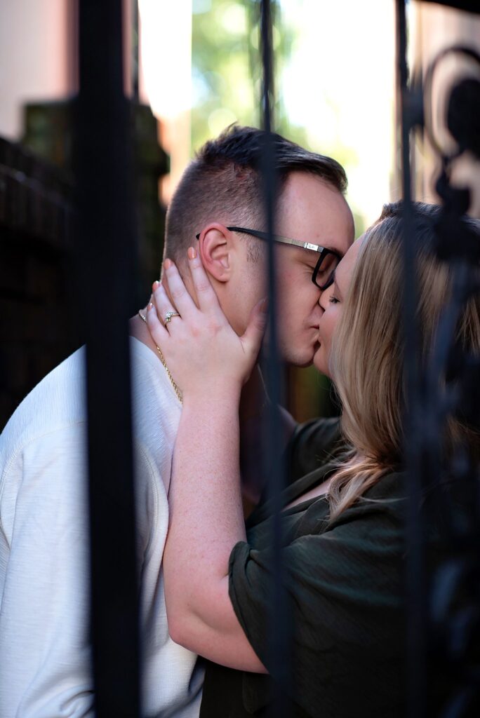 couple kissing at their savannah georgia engagement photos