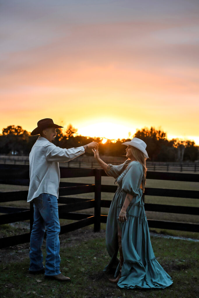 Couple at sunset on the farm. 