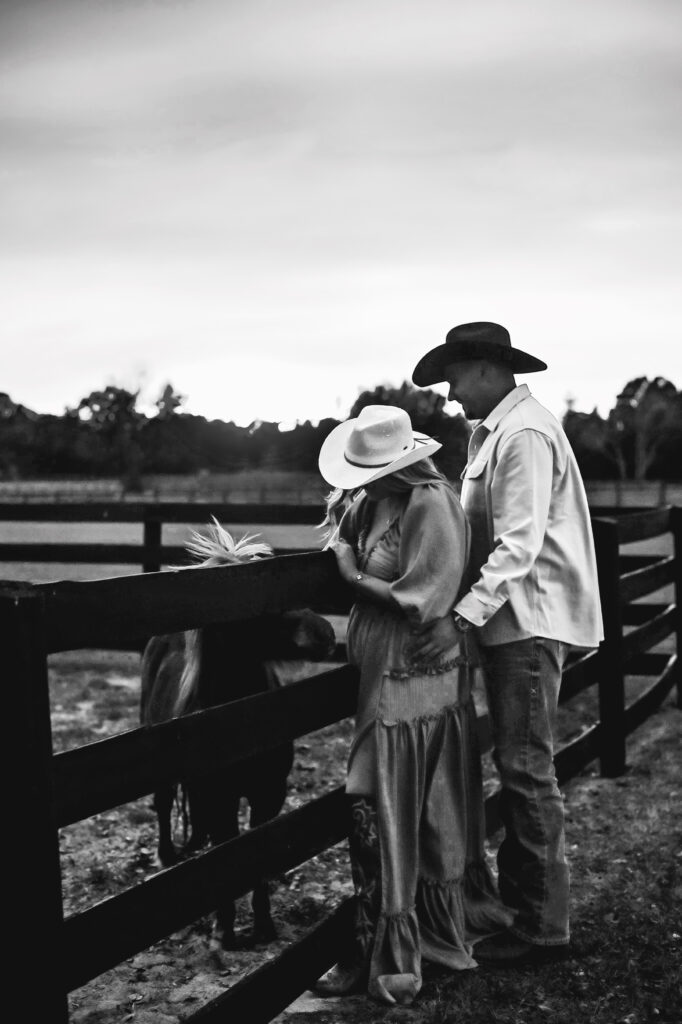 couple engagement session with horses