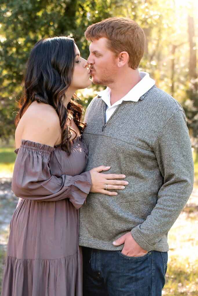 couple kissing at golden hour