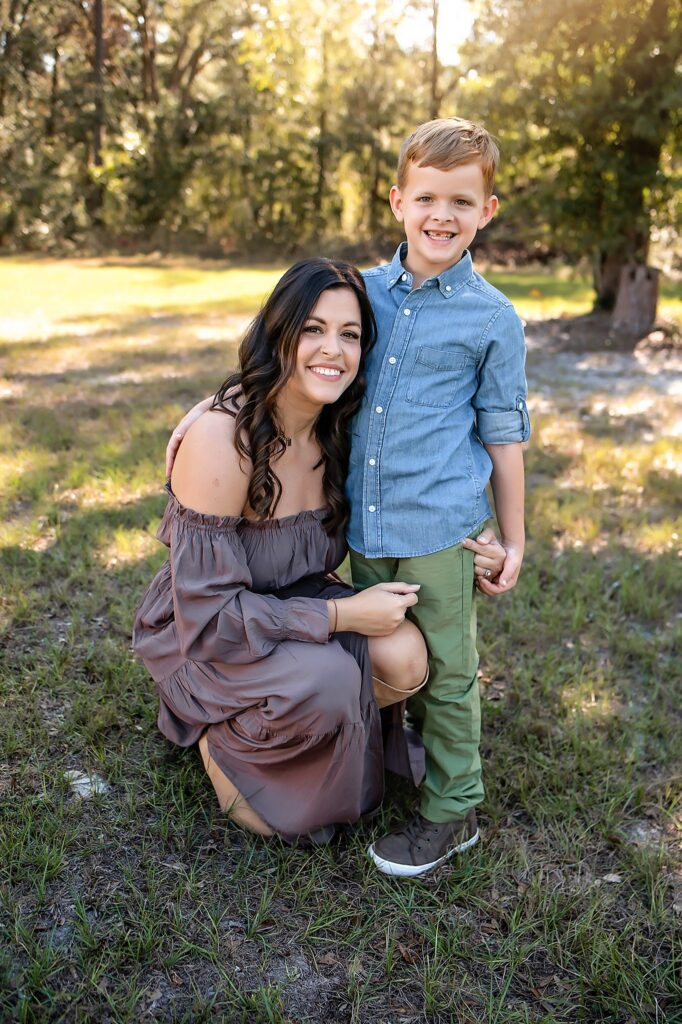 mother and son smiling at the camera