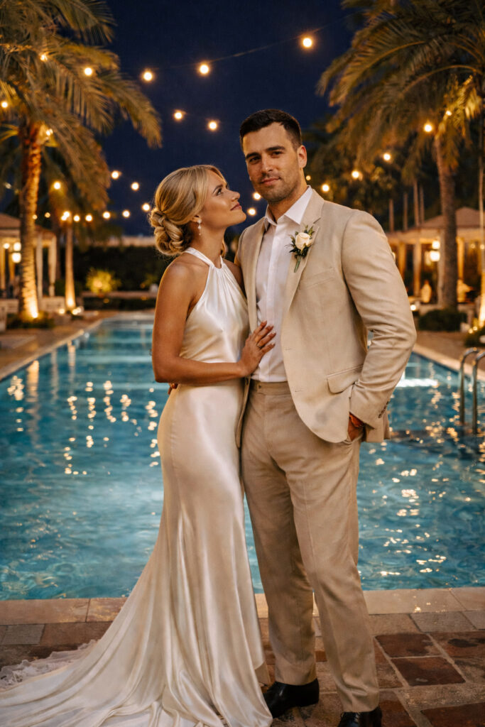 The Miami Beach Edition wedding venue. A couple stands next to each other by the pool at the miami wedding venue.