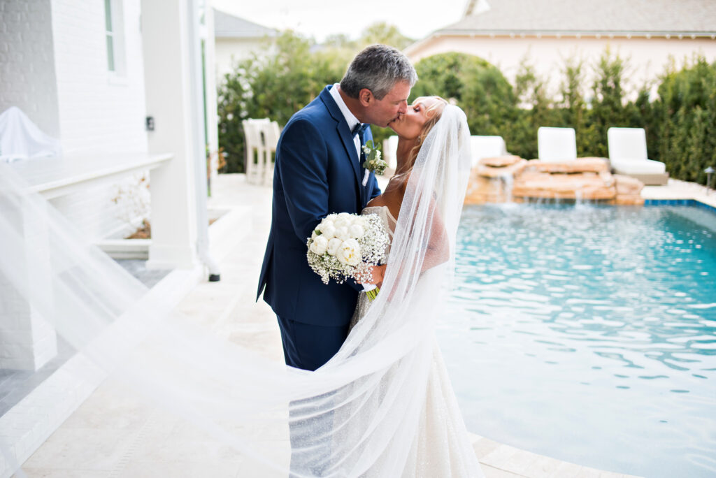 Romantic couple portrait inside the sunroom at their Atlantic Beach Florida intimate wedding at home