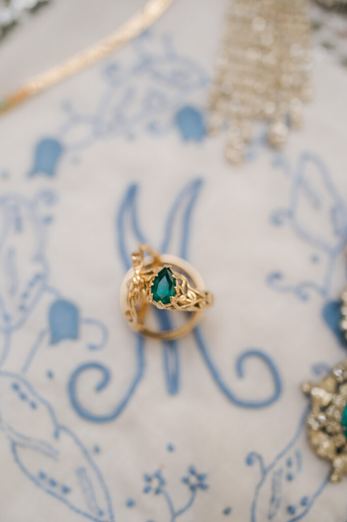 Emerald engagement ring detail photographed during a Thomas Center wedding in Gainesville FL