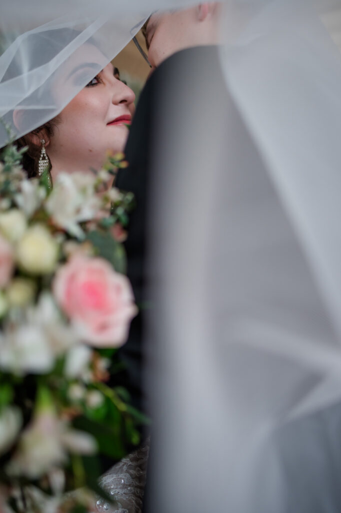 Romantic veil portrait at a Thomas Center wedding captured by a Gainesville wedding photographer