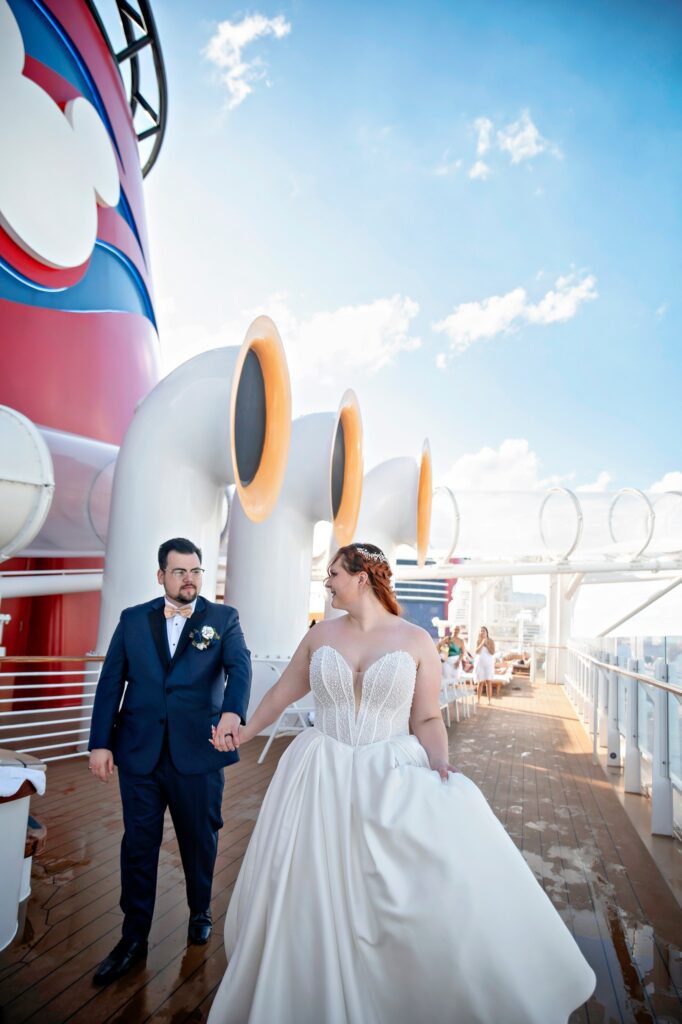 Bride + Groom on deck of the Disney Wish on their wedding day